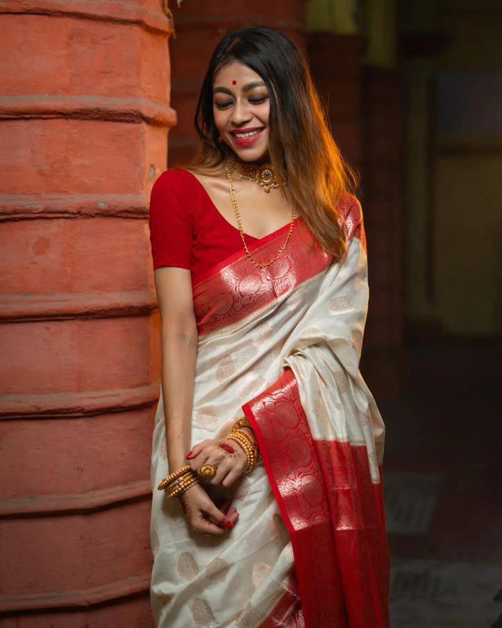 Moiety Off-white and Red Zari Woven Banarasi Saree With Blouse