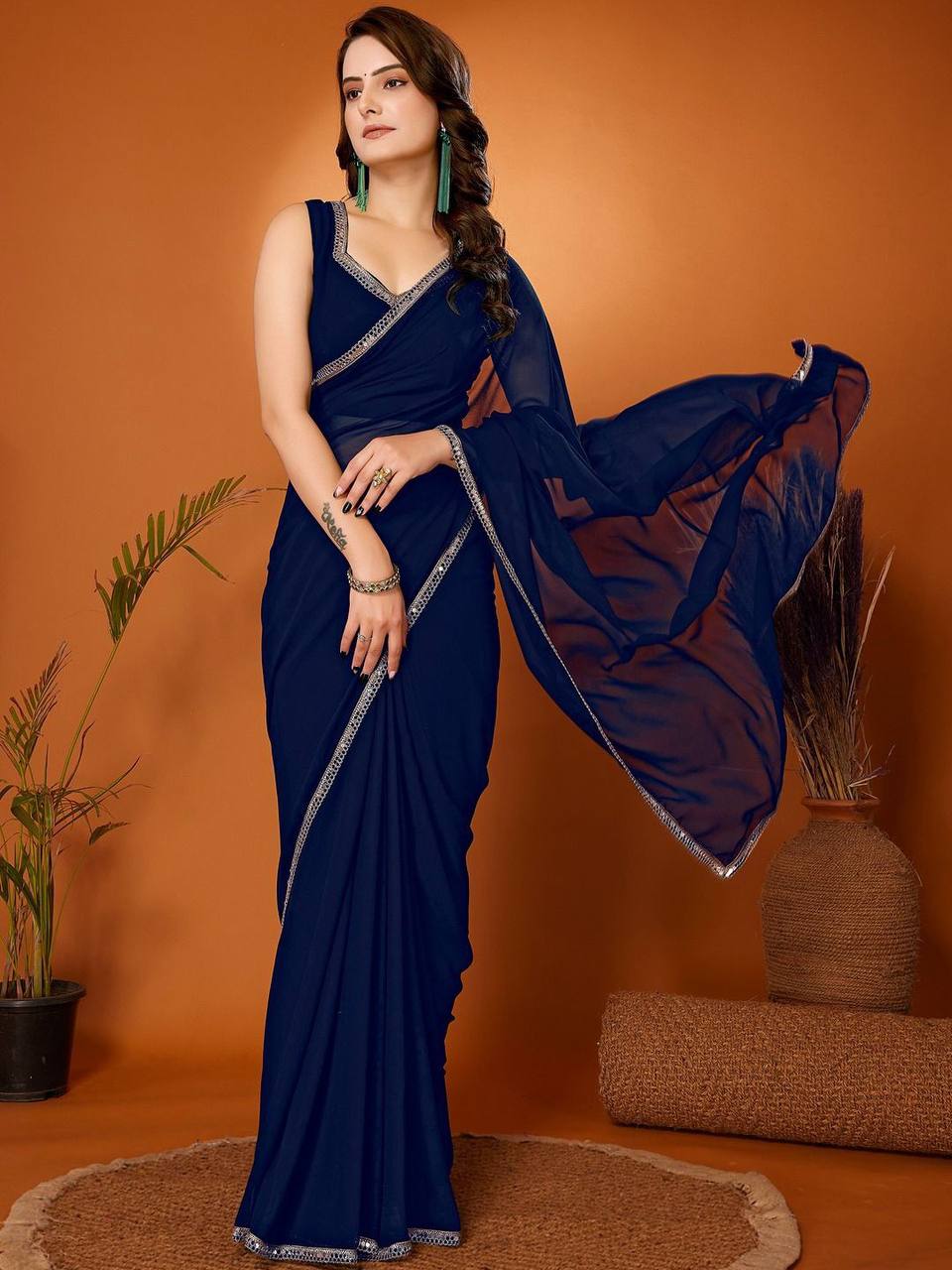 Prominent Georgette Saree With Mirror Lace Border