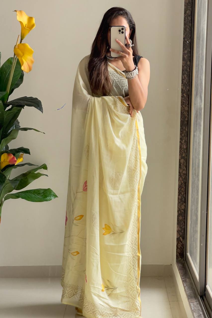 Light Yellow Saree with Subtle Floral Accents And Intricate Woven Border