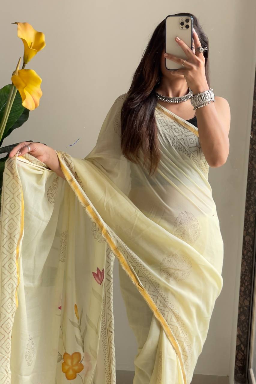 Light Yellow Saree with Subtle Floral Accents And Intricate Woven Border