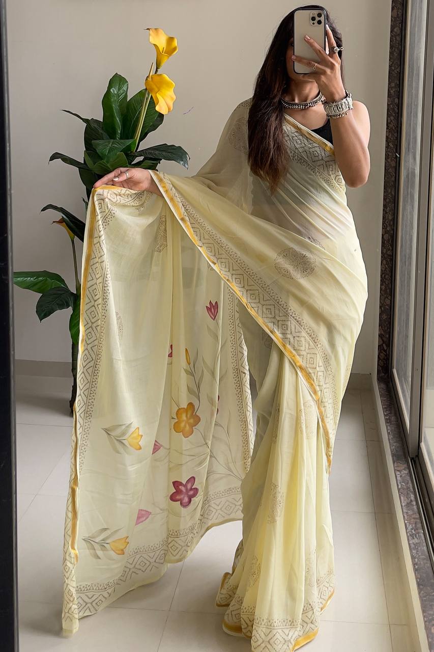 Light Yellow Saree with Subtle Floral Accents And Intricate Woven Border