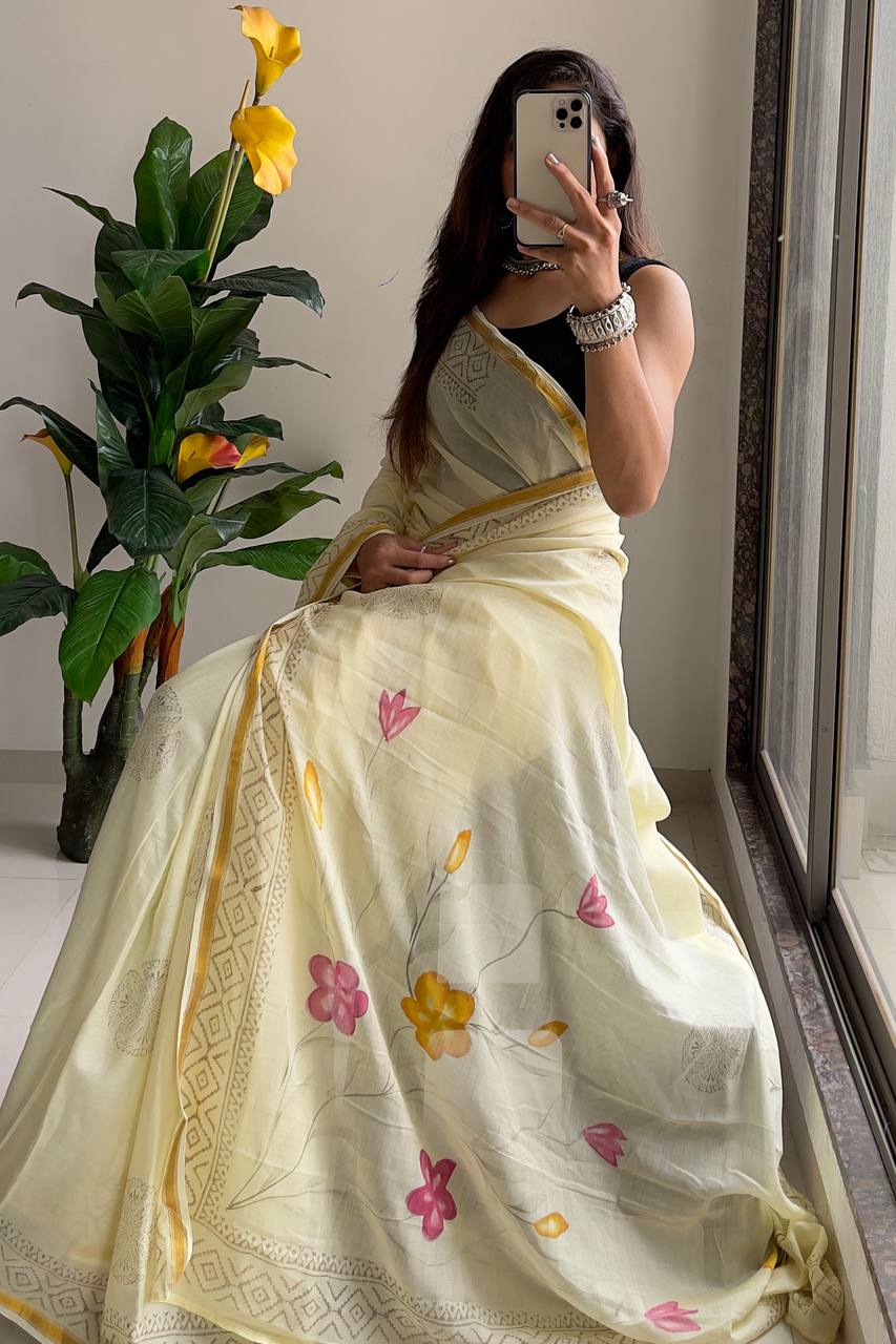 Light Yellow Saree with Subtle Floral Accents And Intricate Woven Border