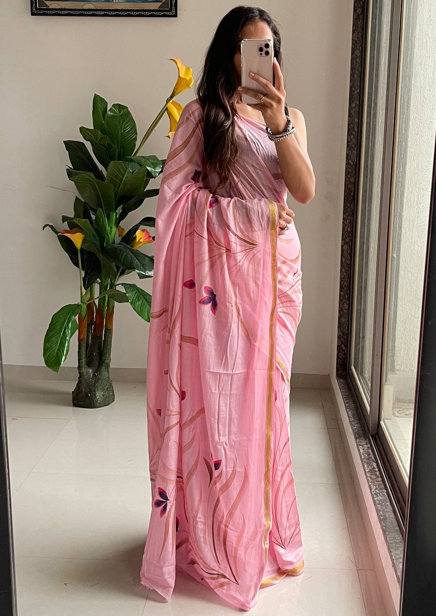 Elegant Soft Pink Hand-Painted Floral Saree With Subtle Golden Border