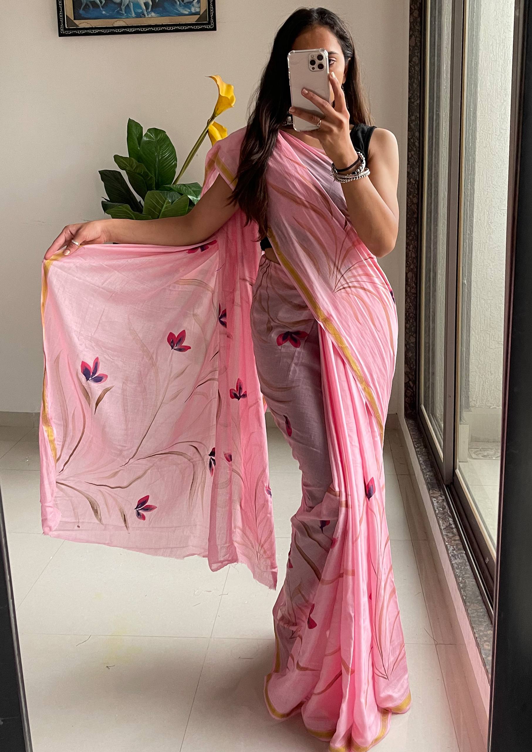 Elegant Soft Pink Hand-Painted Floral Saree With Subtle Golden Border