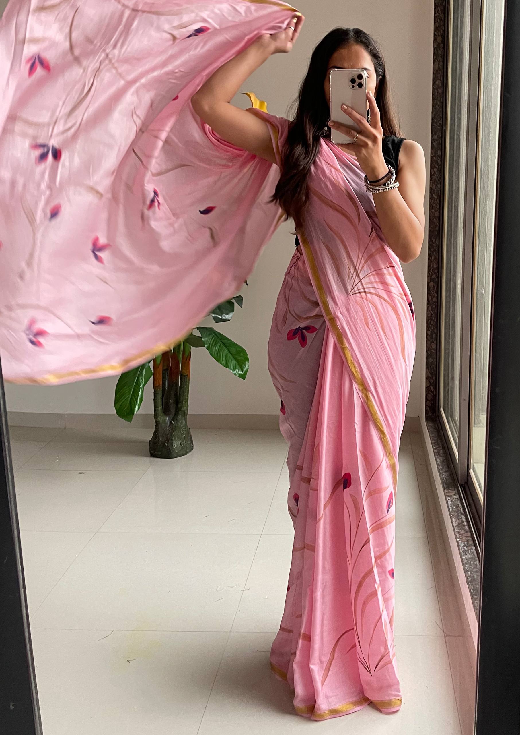 Elegant Soft Pink Hand-Painted Floral Saree With Subtle Golden Border