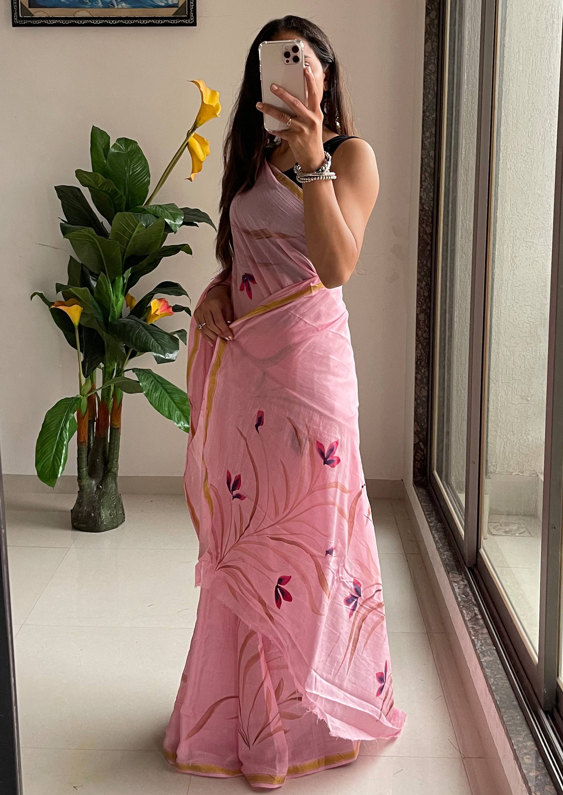 Elegant Soft Pink Hand-Painted Floral Saree With Subtle Golden Border