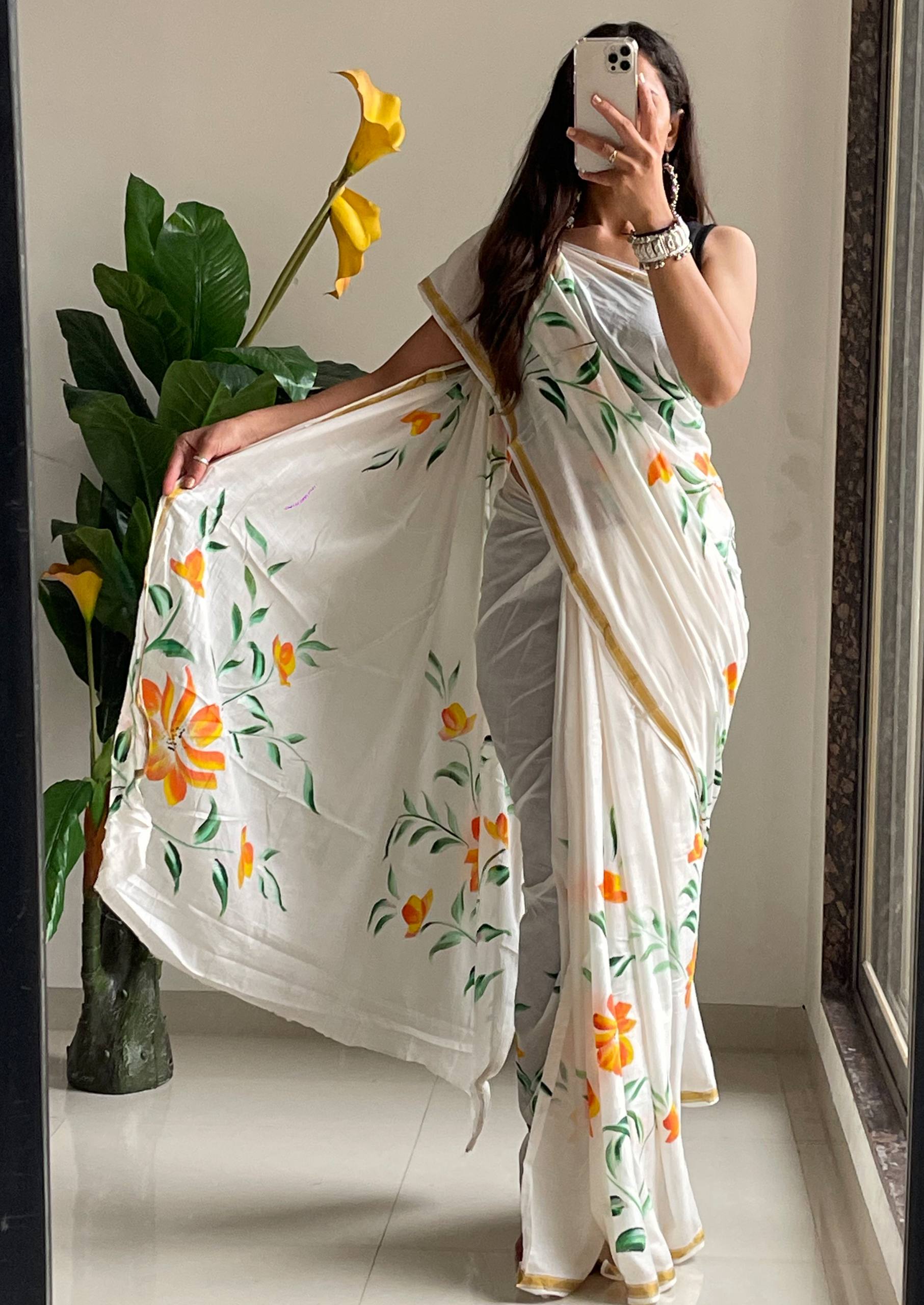 Elegant White Saree With Hand-Painted Yellow and Orange Floral Designs
