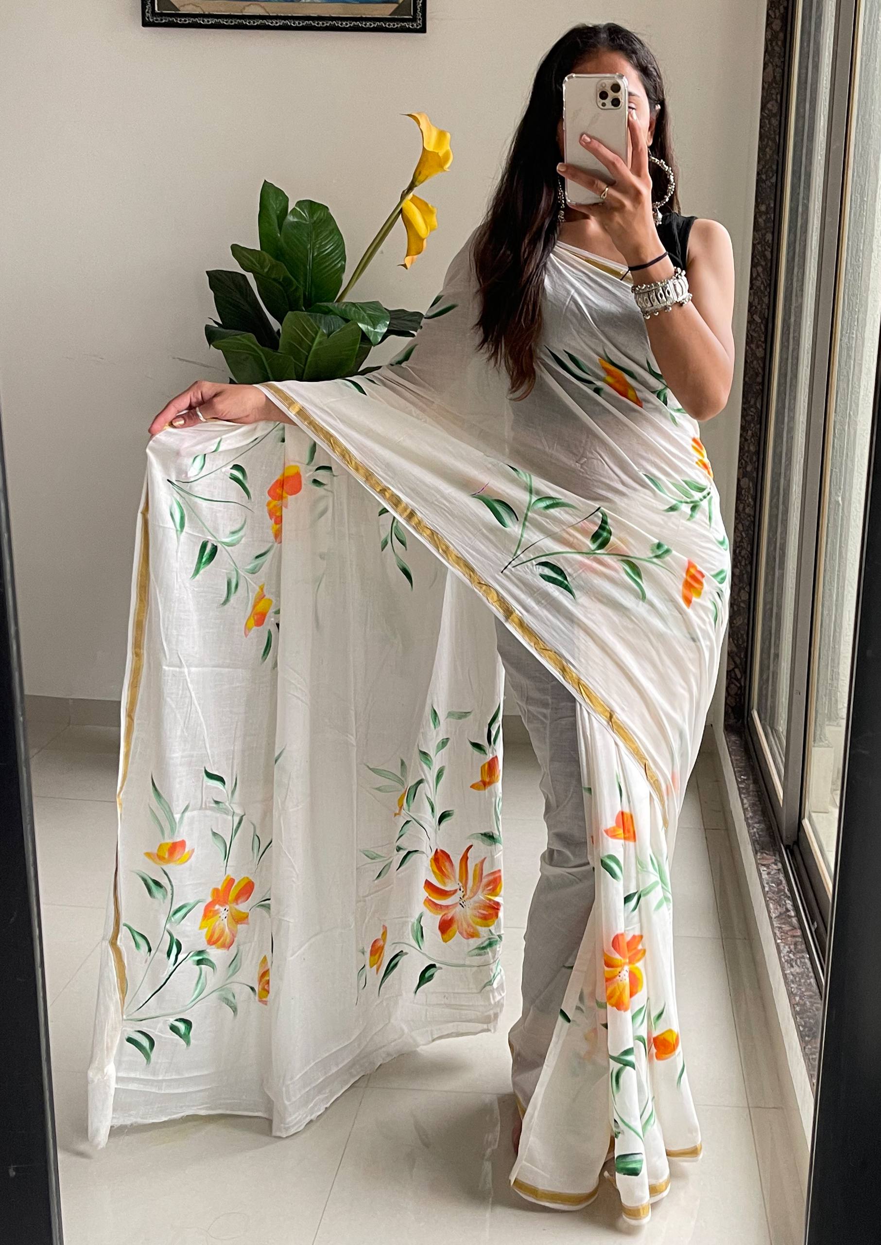 Elegant White Saree With Hand-Painted Yellow and Orange Floral Designs