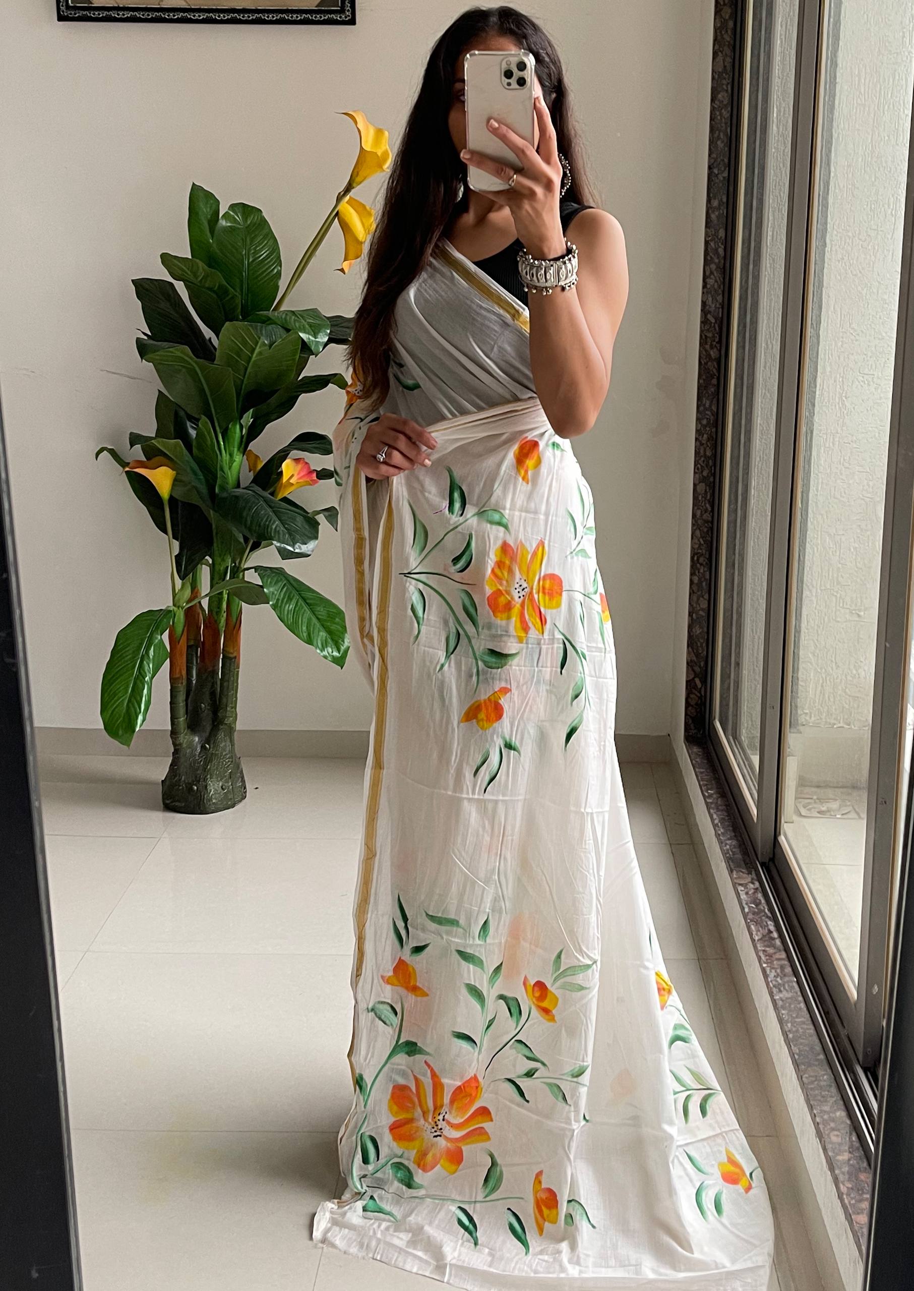 Elegant White Saree With Hand-Painted Yellow and Orange Floral Designs